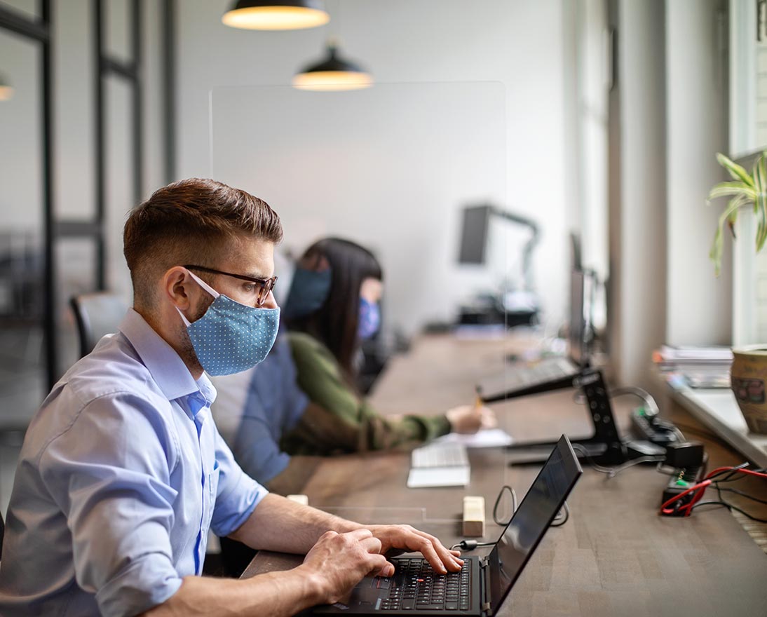 man working with mask on