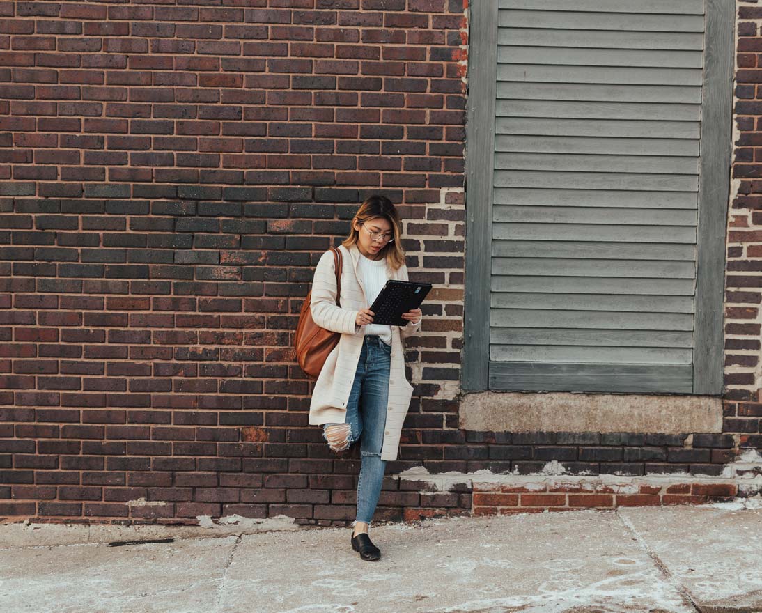 woman holding tablet