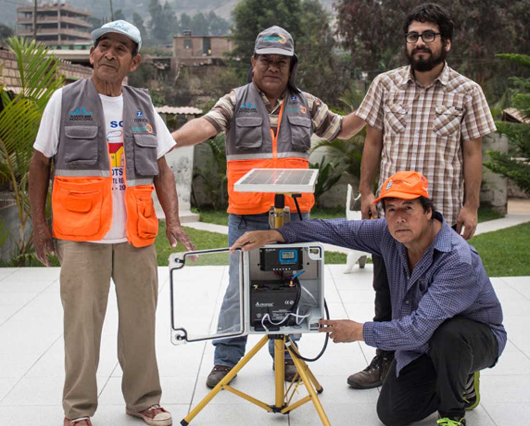 Men standing with early warning system