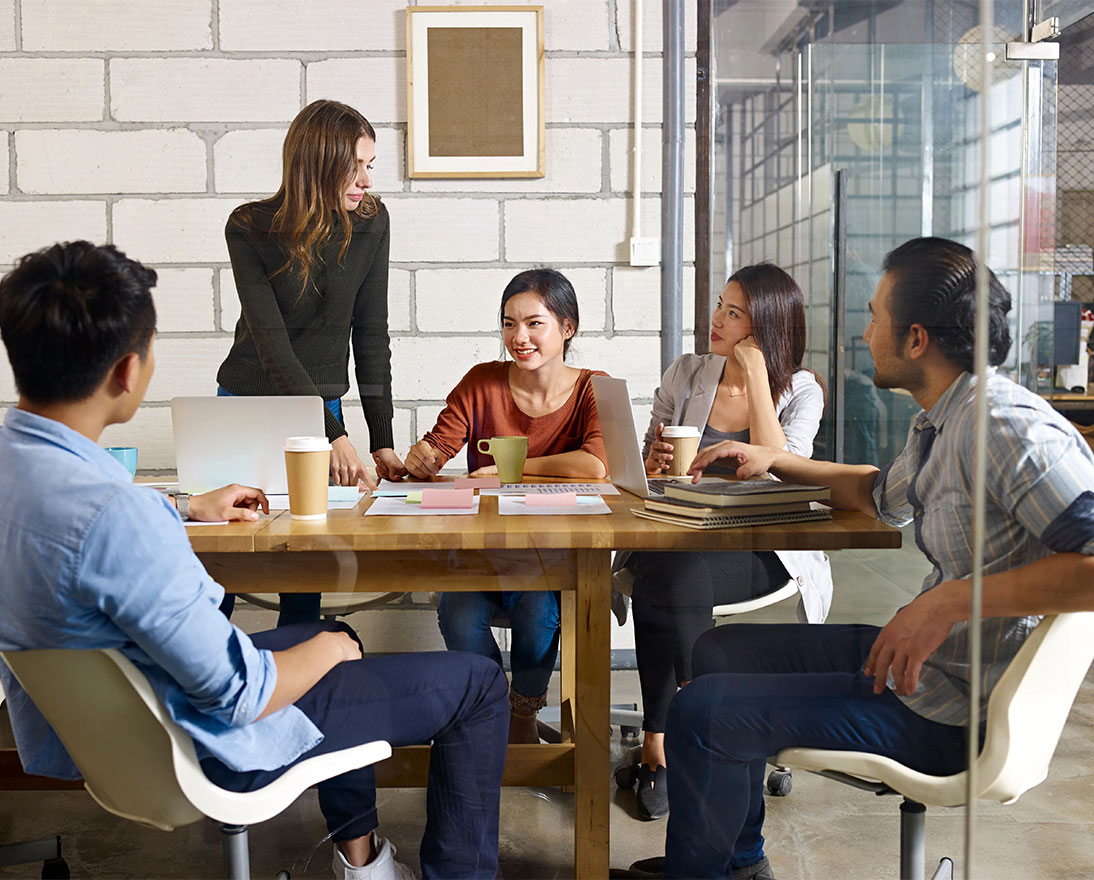 colleagues sitting around a table