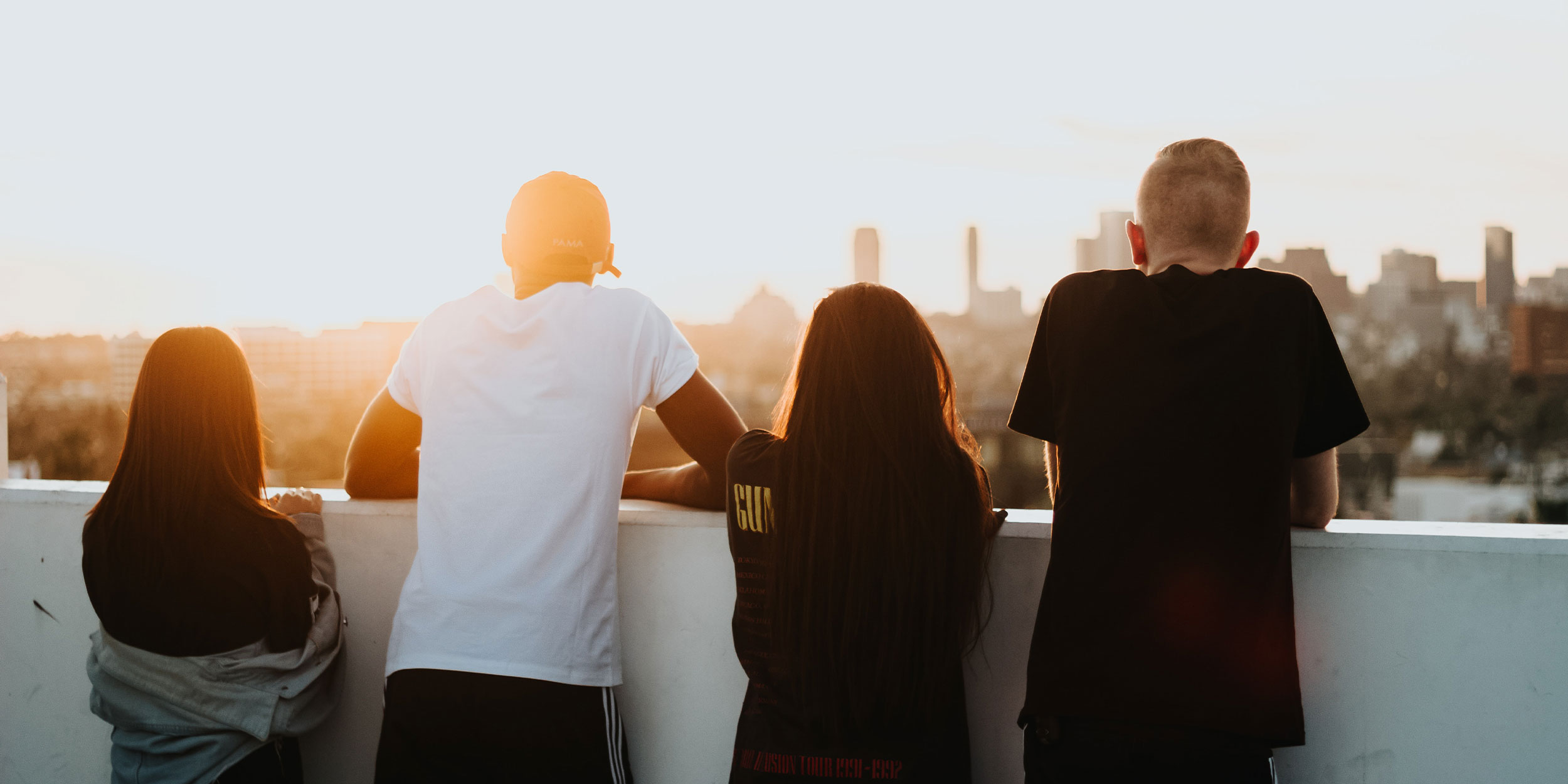 4 people looking at a skyline