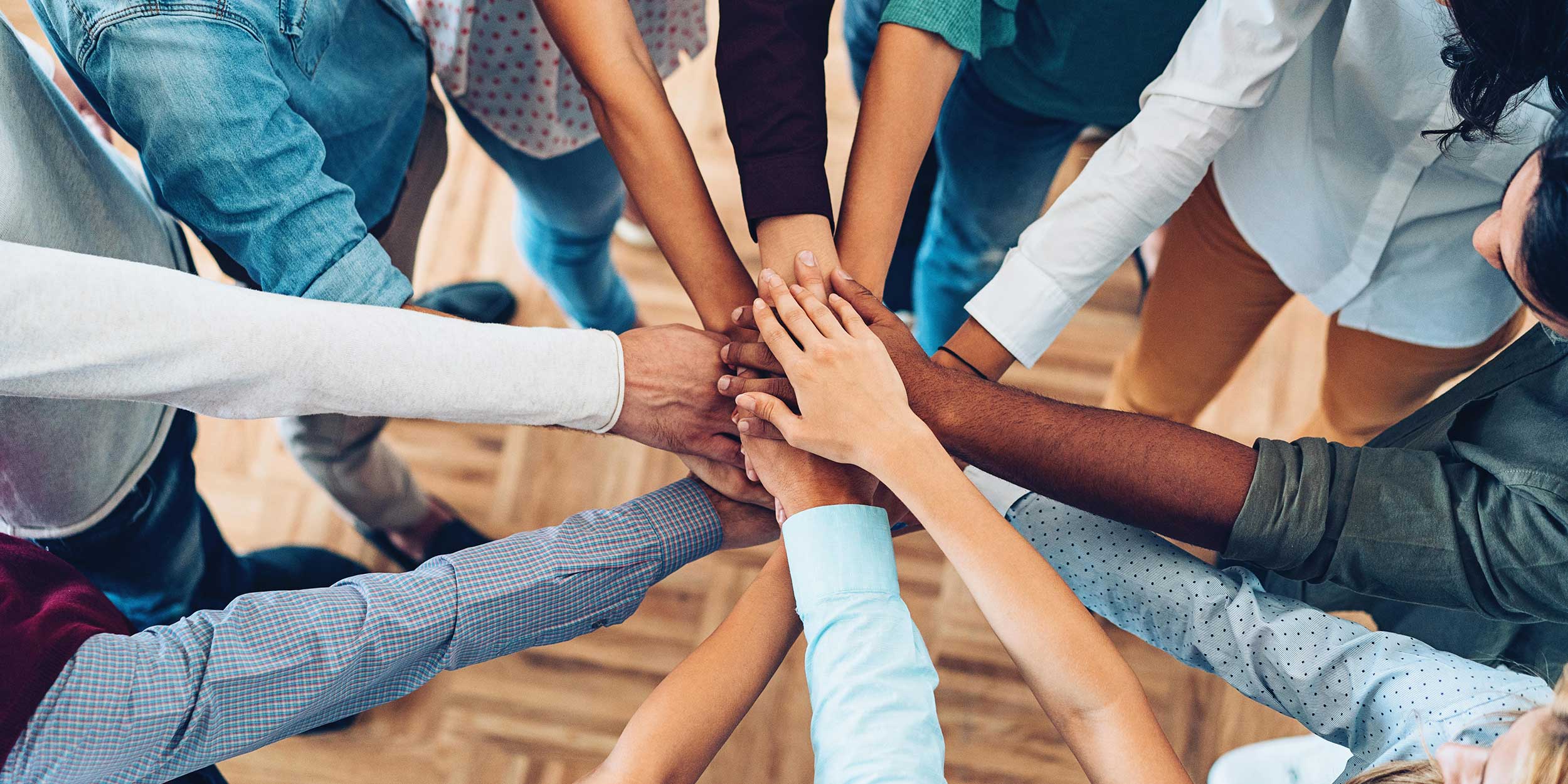 people stacking hands