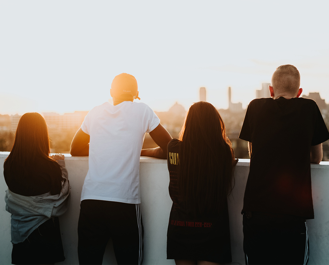 4 people looking at a skyline