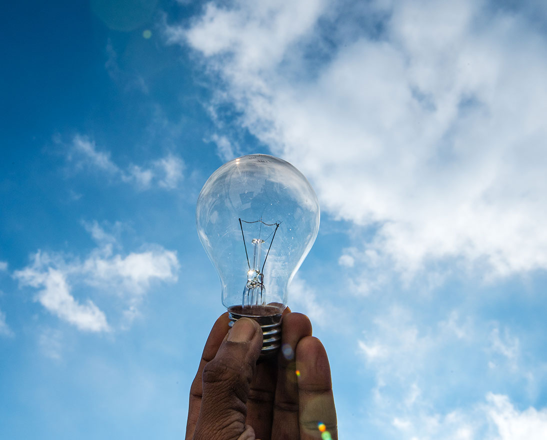 holding a lightbulb