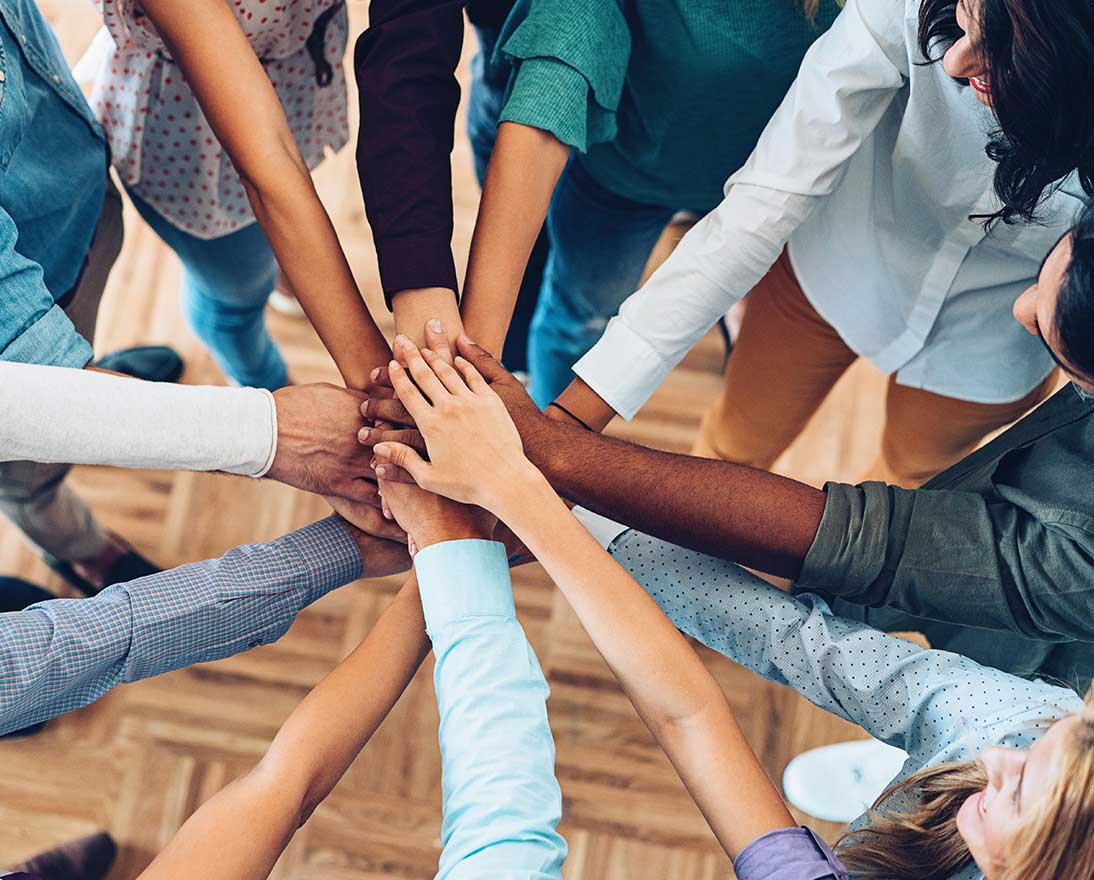 people stacking hands