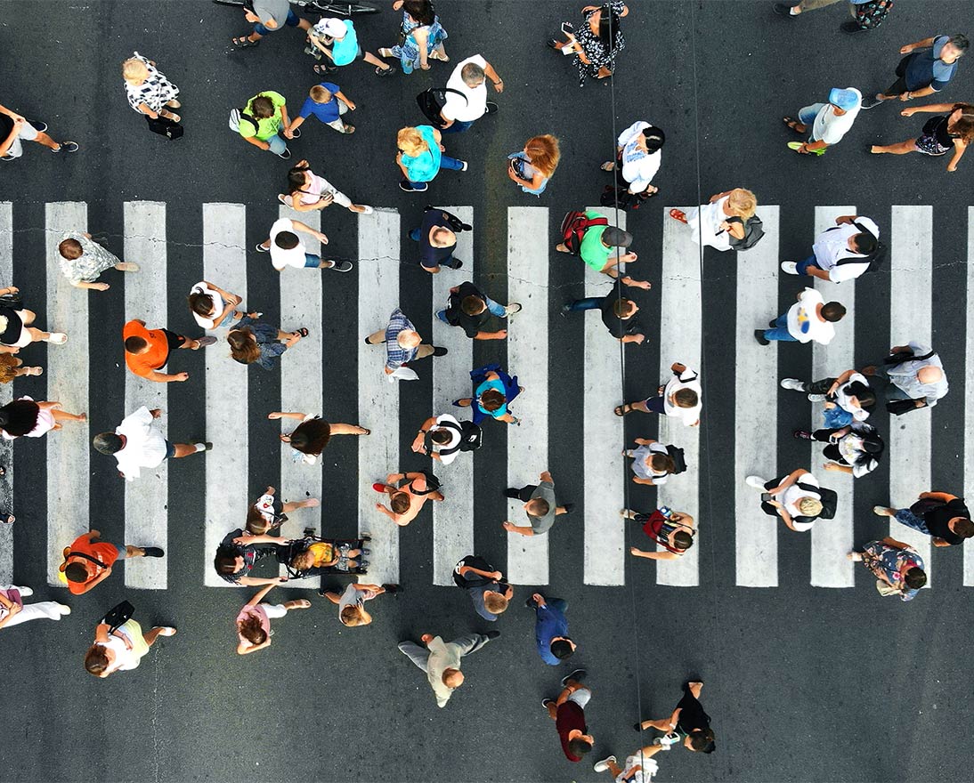 large group of people crossing the street