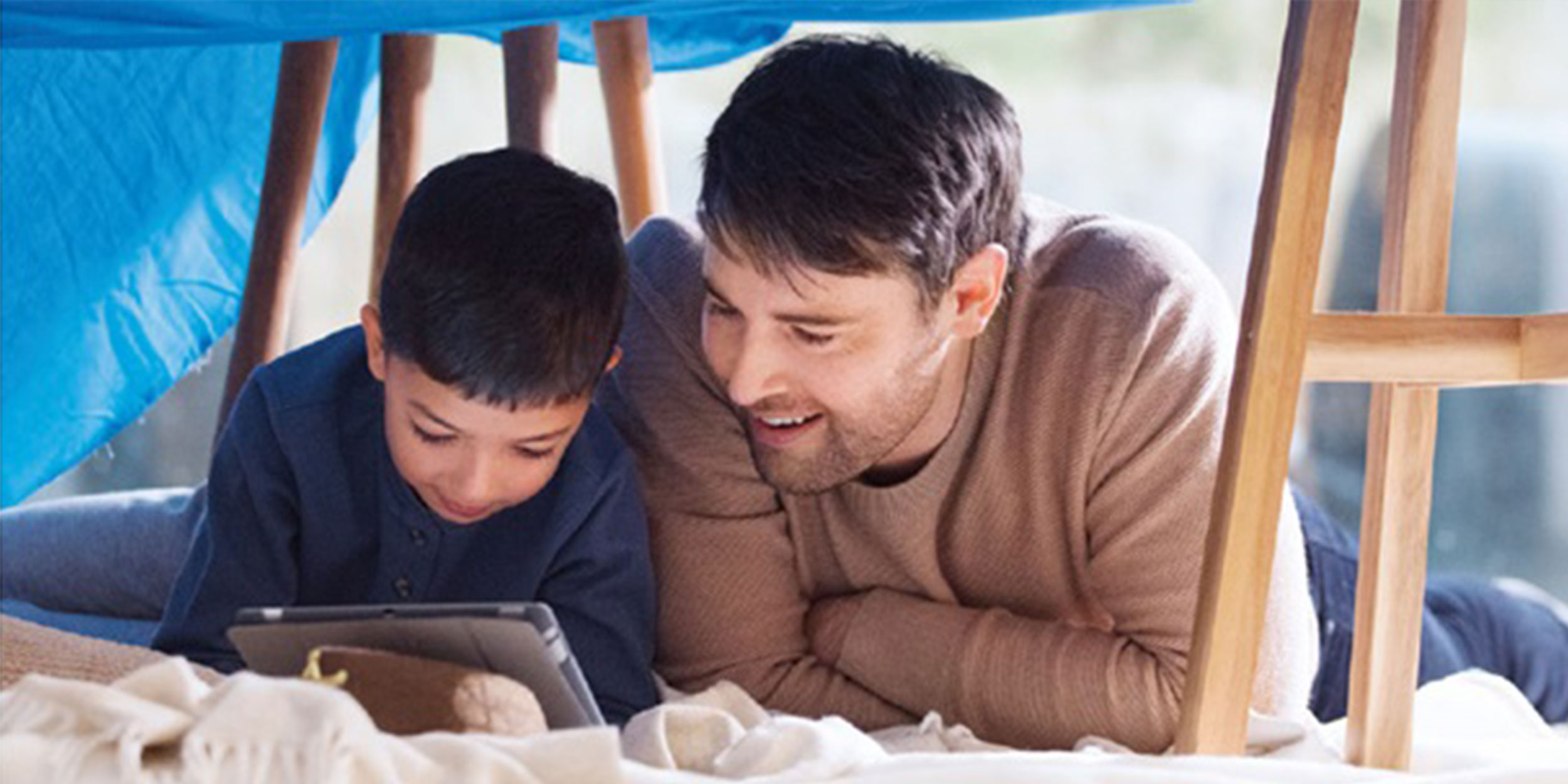 stage boy and man with tablet