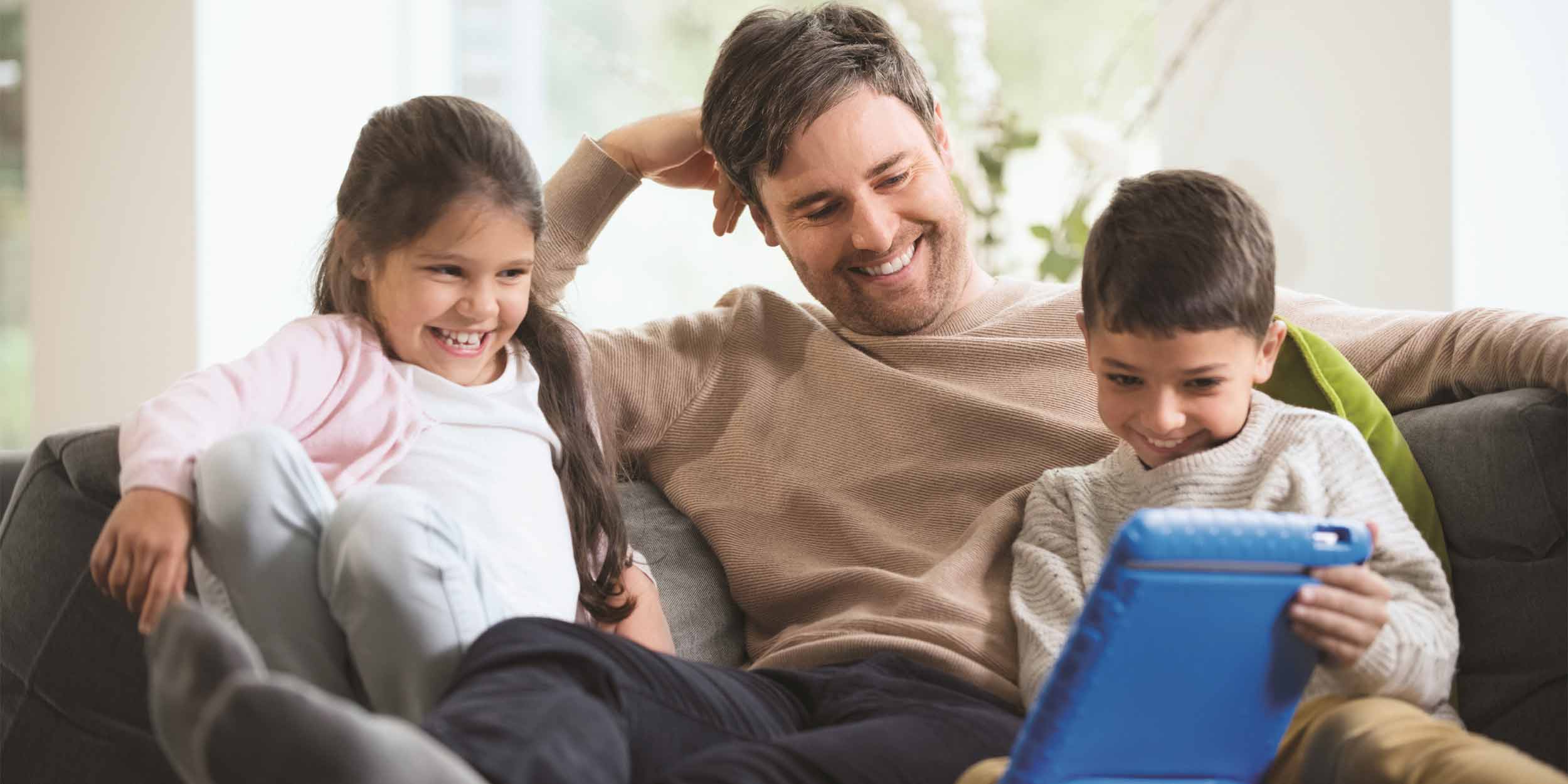 stage man on sofa with kids