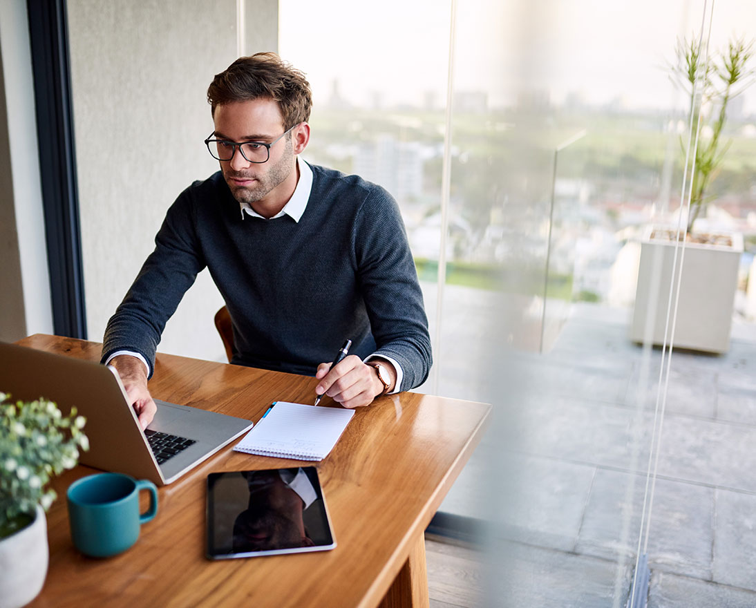 man looking at laptop