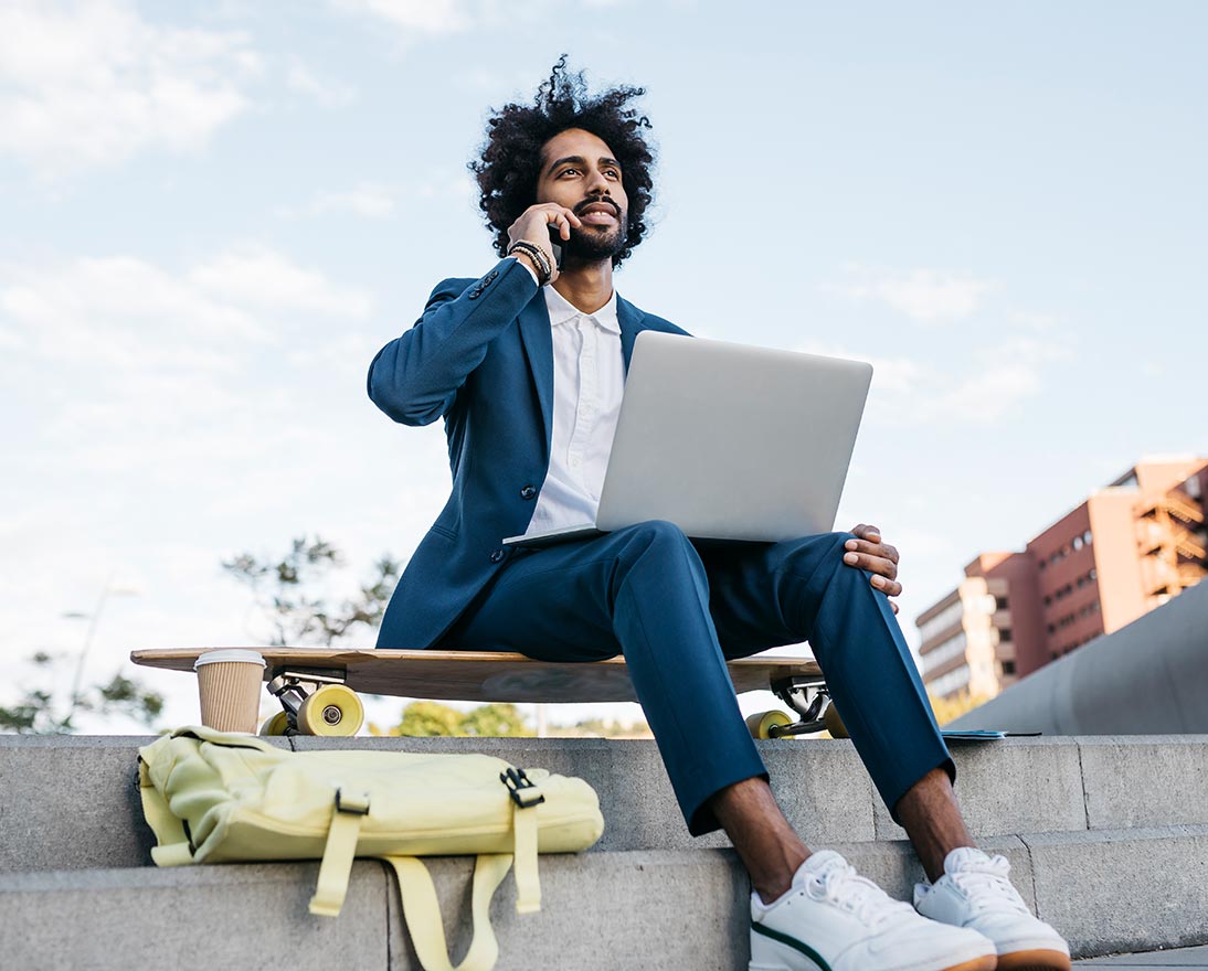 man sitting on skateboard