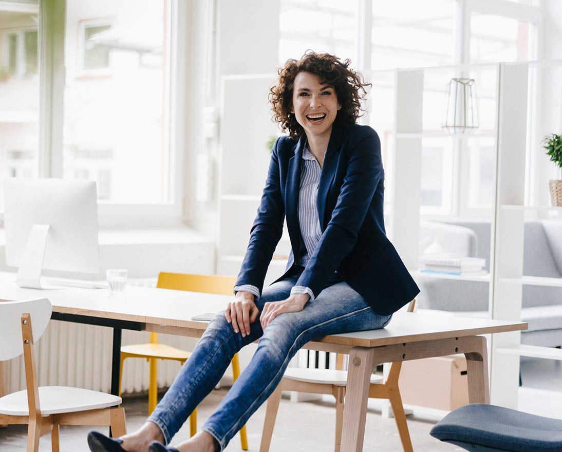 woman sitting on desk