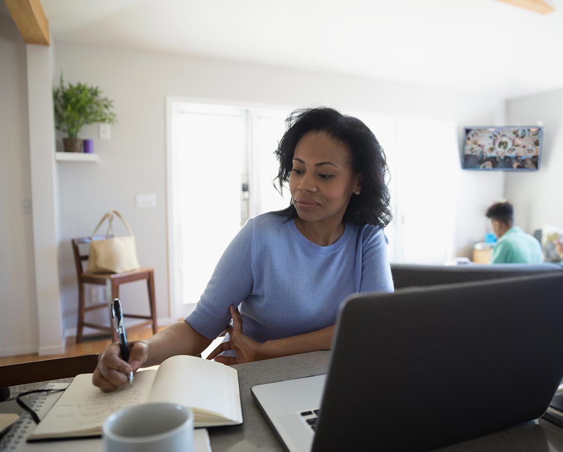 woman writing in notebook