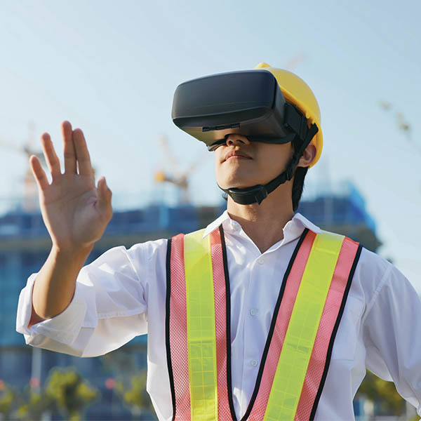 construction worker using vr headset on site