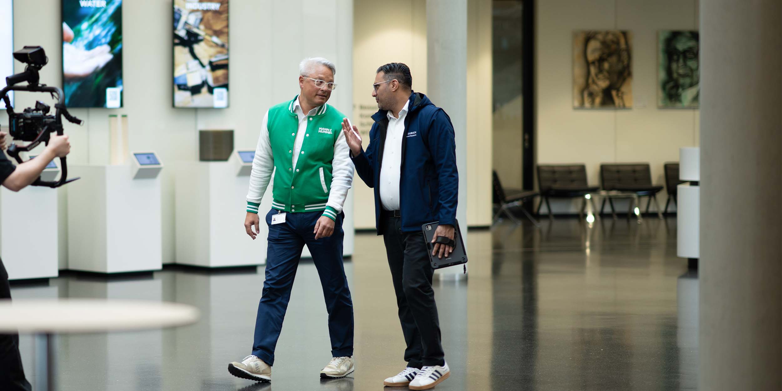 two man walking and talking