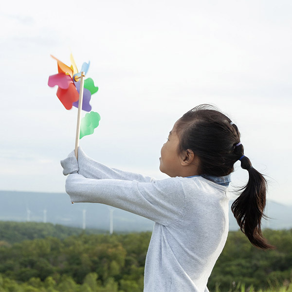little girl holding a windmill