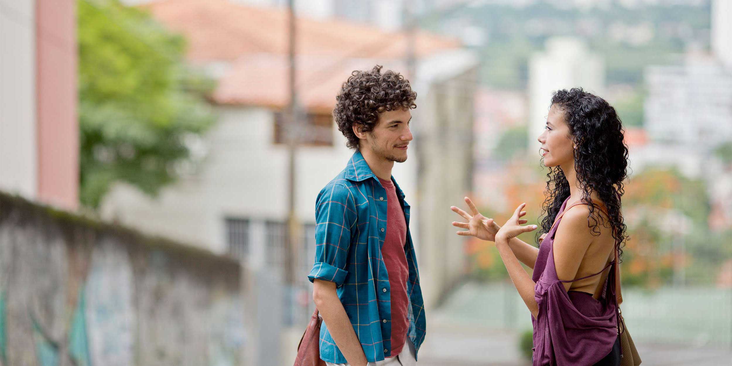 two people talking on the street