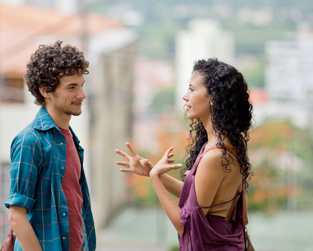 two people talking on the street
