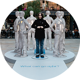 Amy takes a pledge at the statue