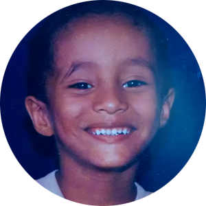 Phil Rodrigues as a child smiling