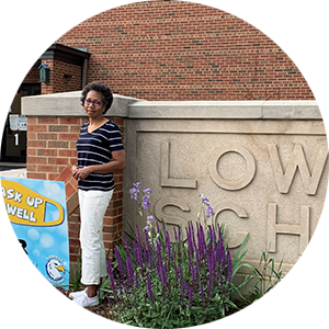 sharon robinson in front of her first school