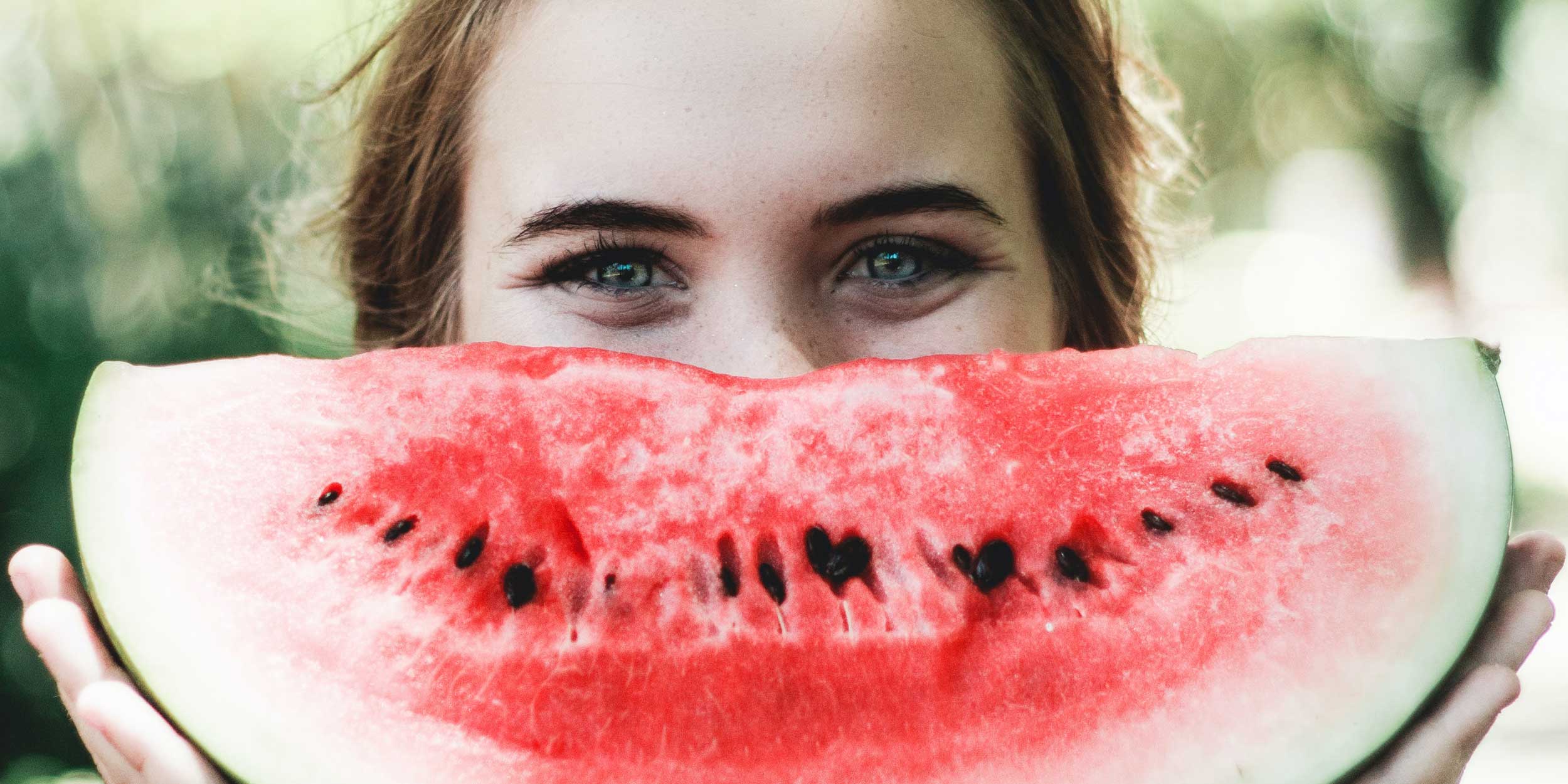 Woman eating a vegan-friendly snack