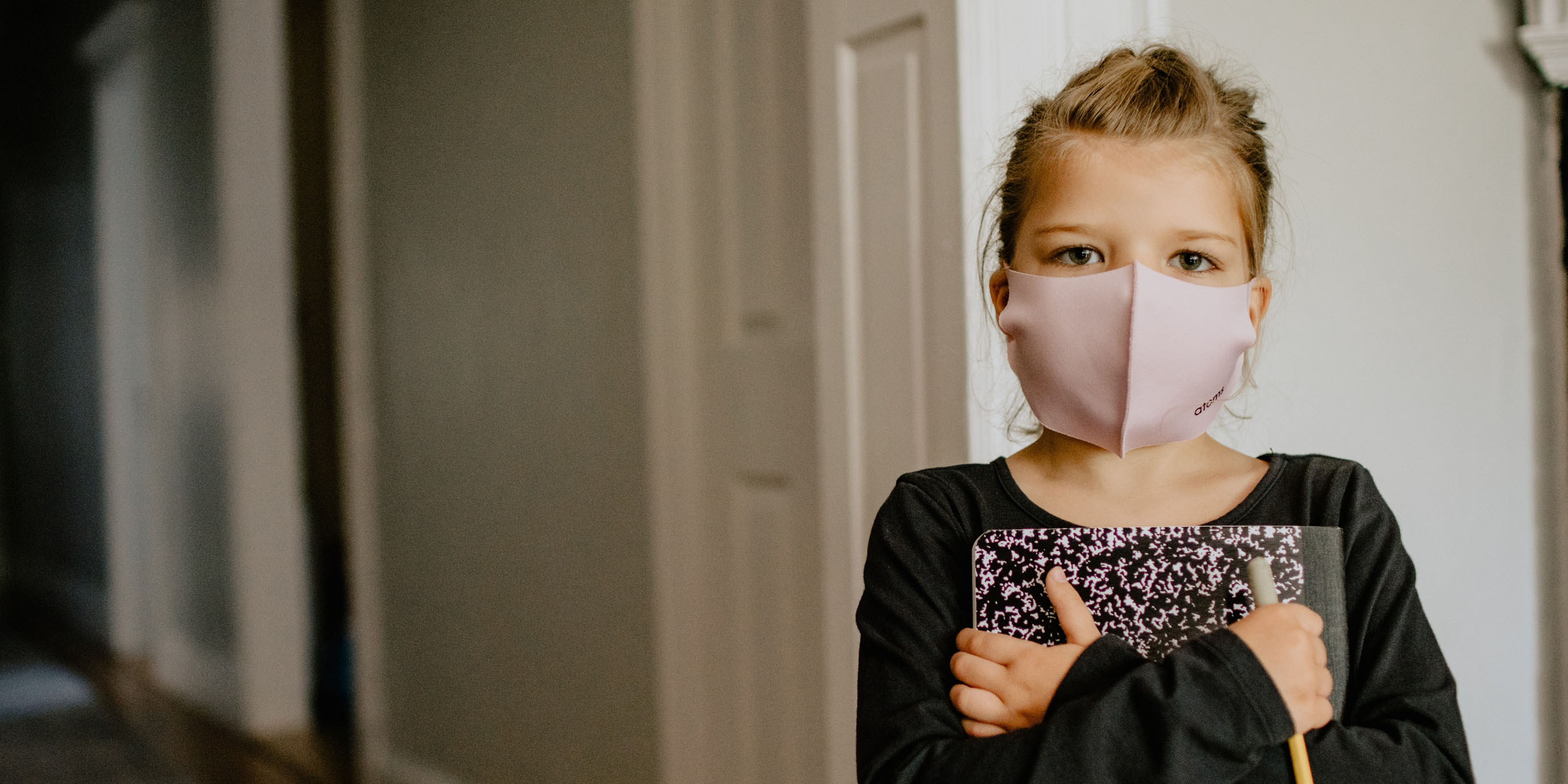 Little girl wearing a face mask