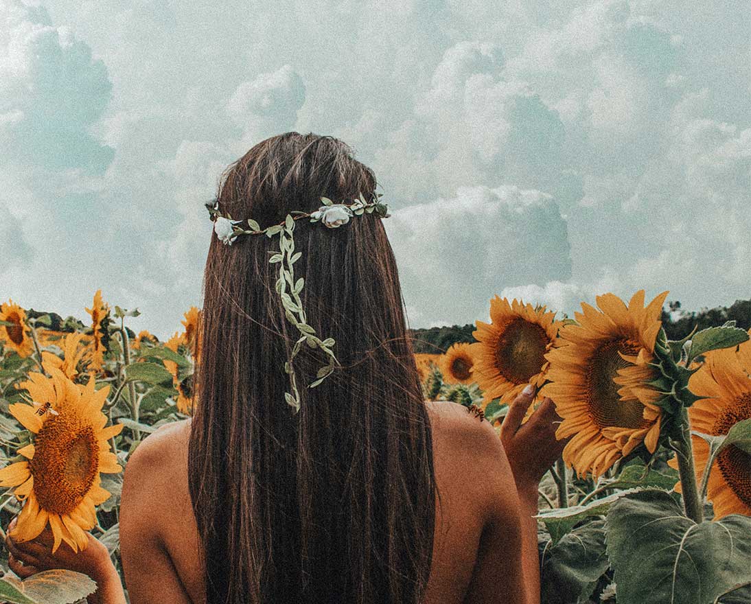 woman in a field of sunflowers