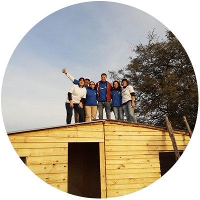 Employees celebrate building an emergency home in La Plata, Buenos Aires