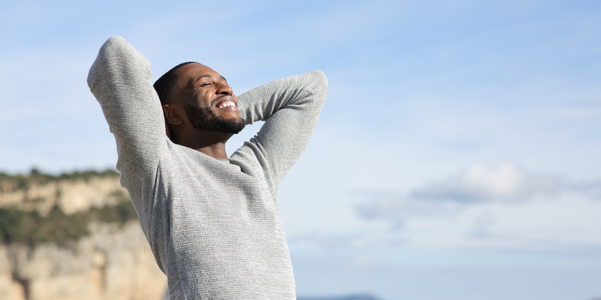 a happy man looking up at the sky