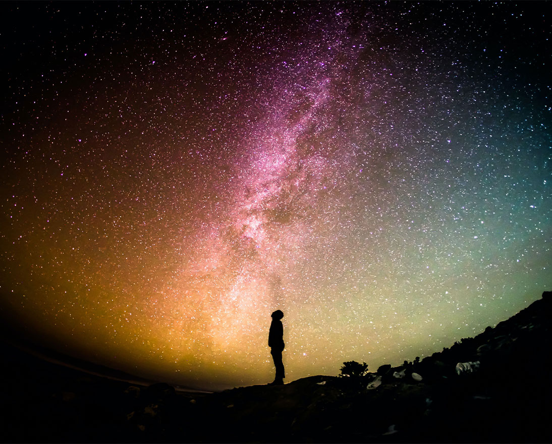 Man looking up at space weather