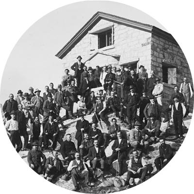 Mountain climbers excursion posing on vintage photo