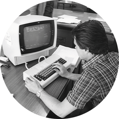 Man working behind a computer in the Zurich data center in 1977