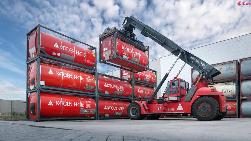 Forklift stacking red Katoen Natie containers