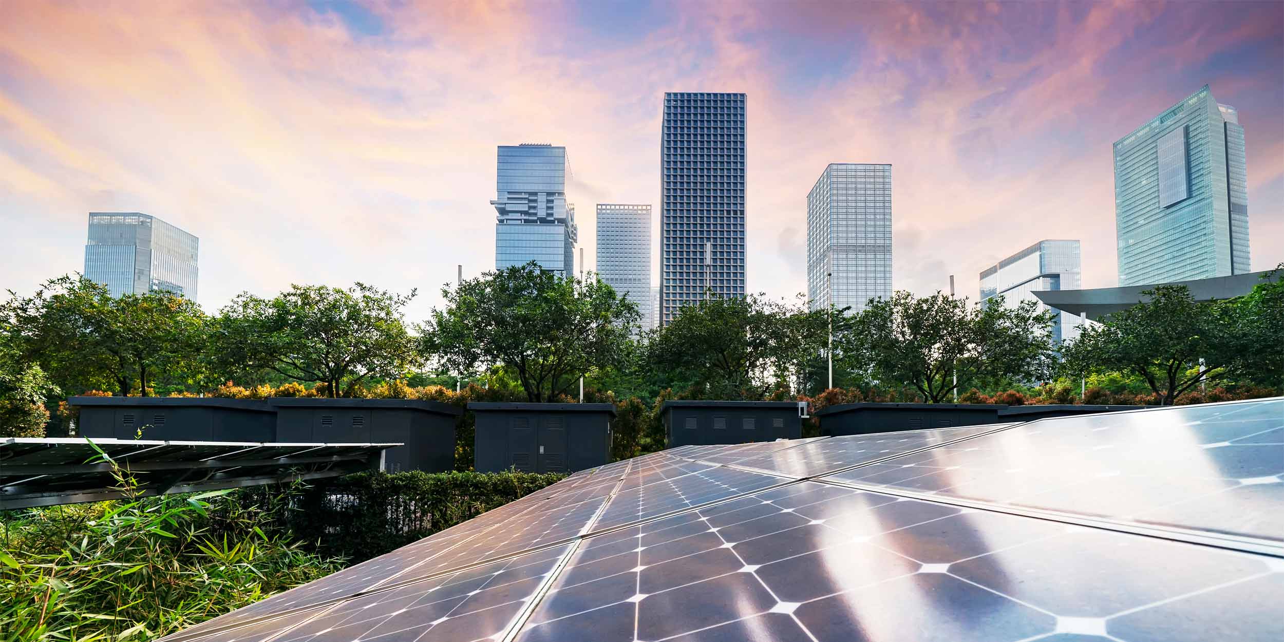 Solar panel plant with urban modern building landscape landmarks in sunset