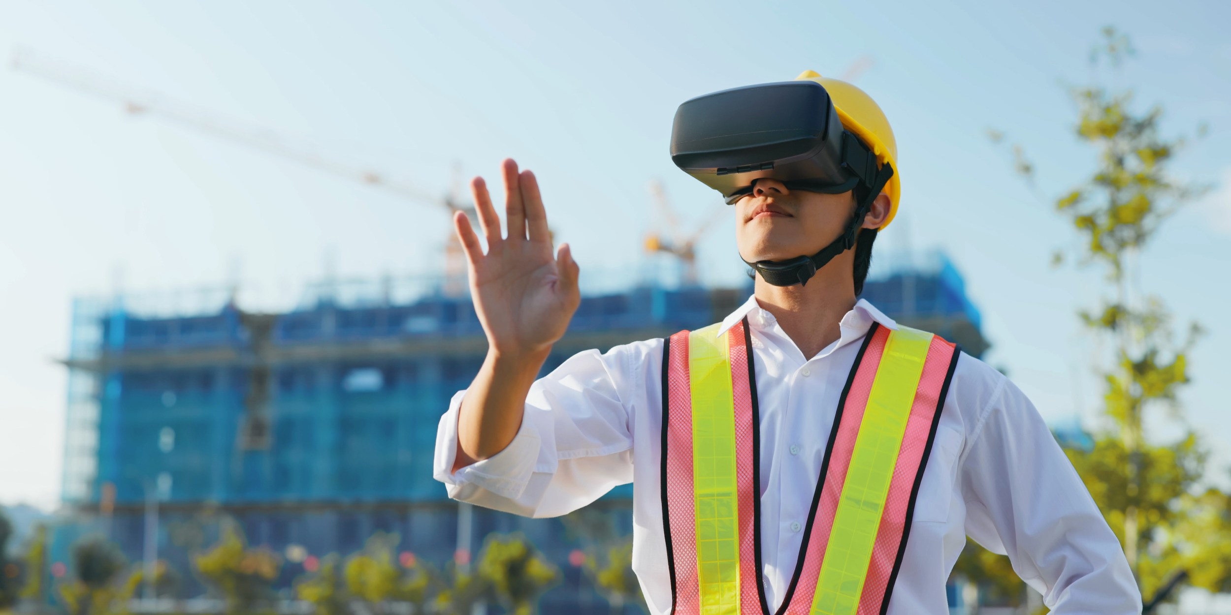 construction worker using vr headset on site