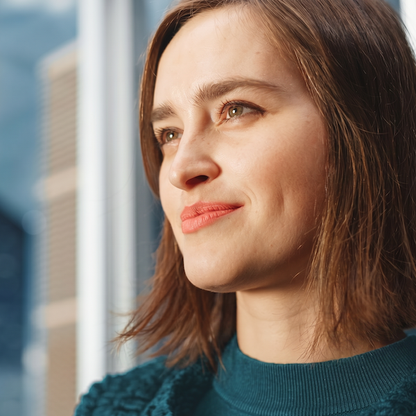 Woman looking out of window