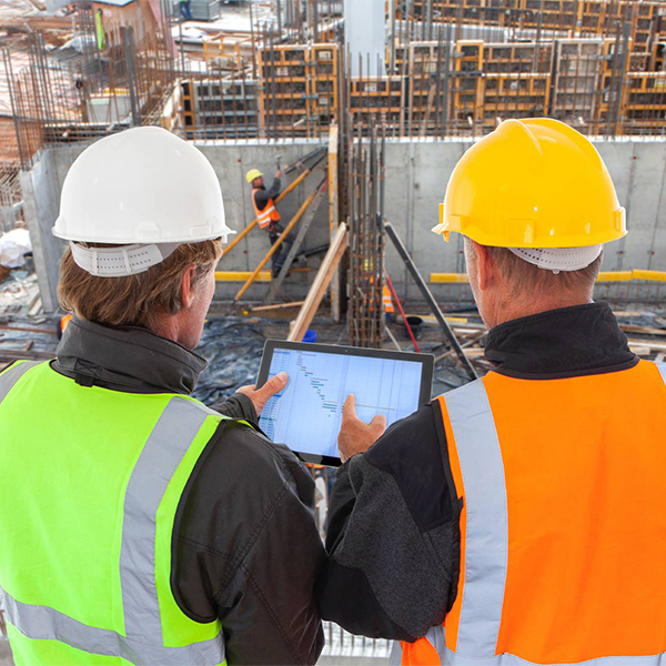 two people looking over a construction site