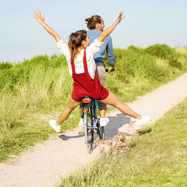 man and woman on a bike