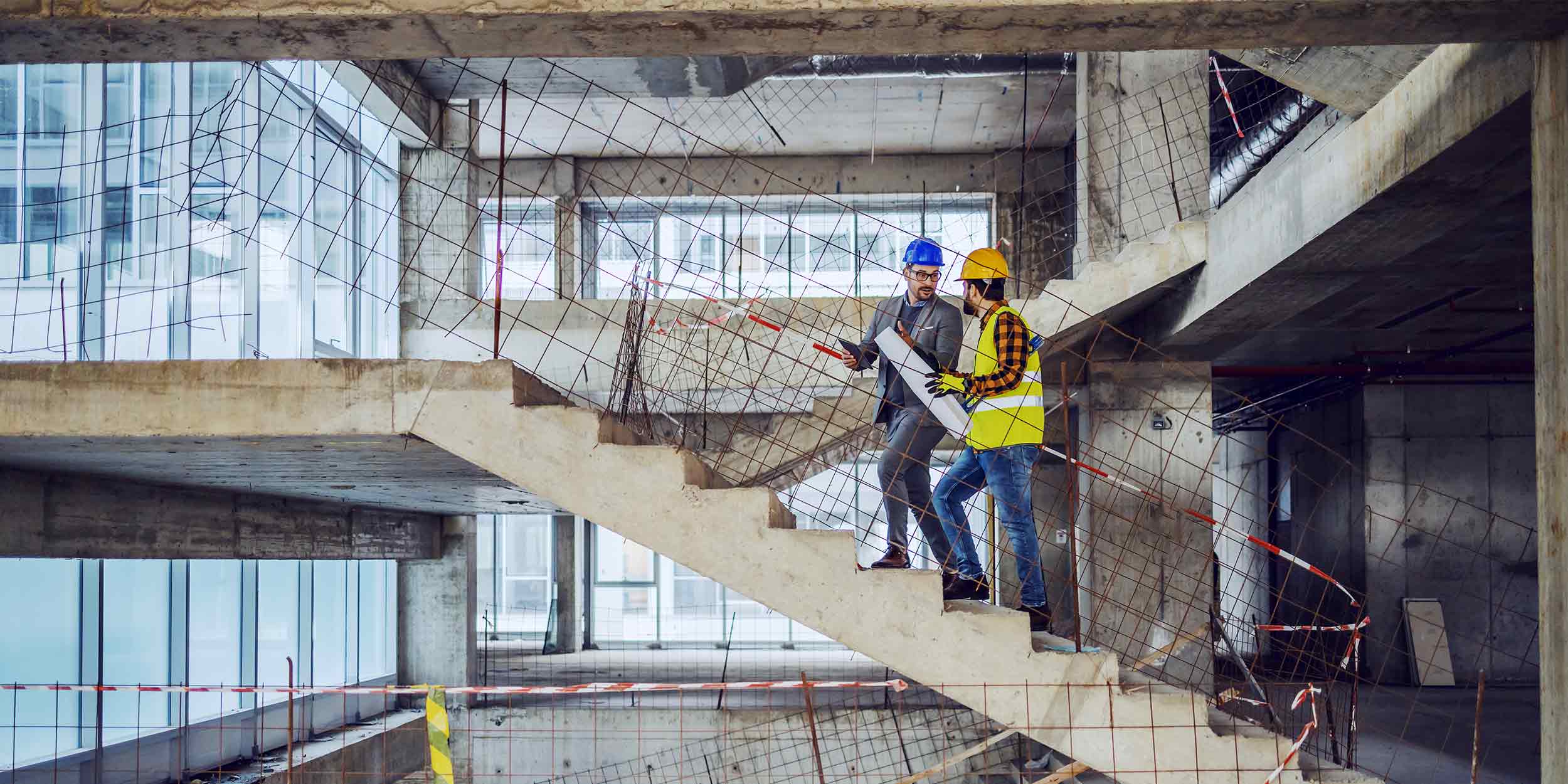 workers walking stairs on construction site