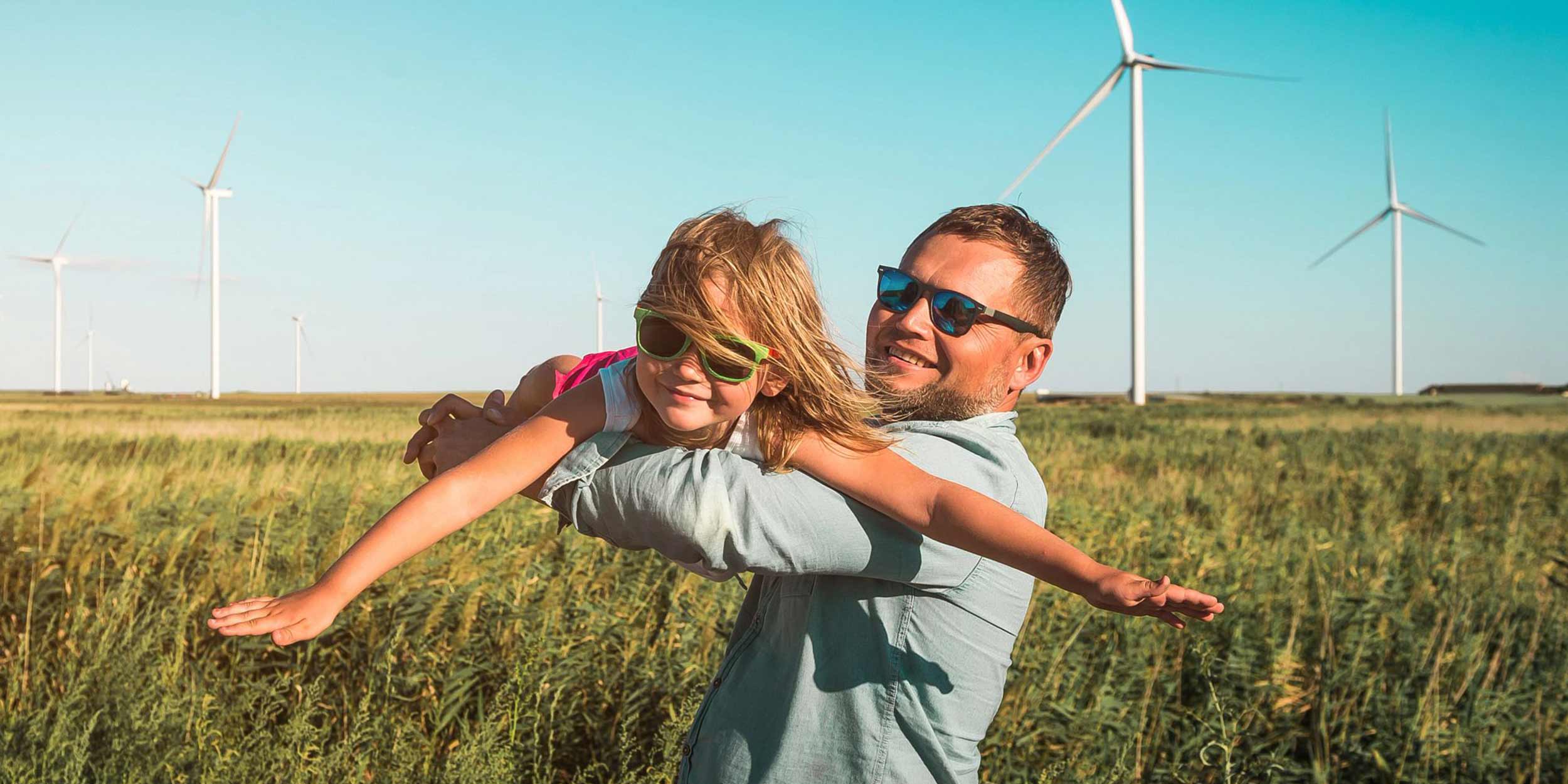 Father lifting daughter in air like plane