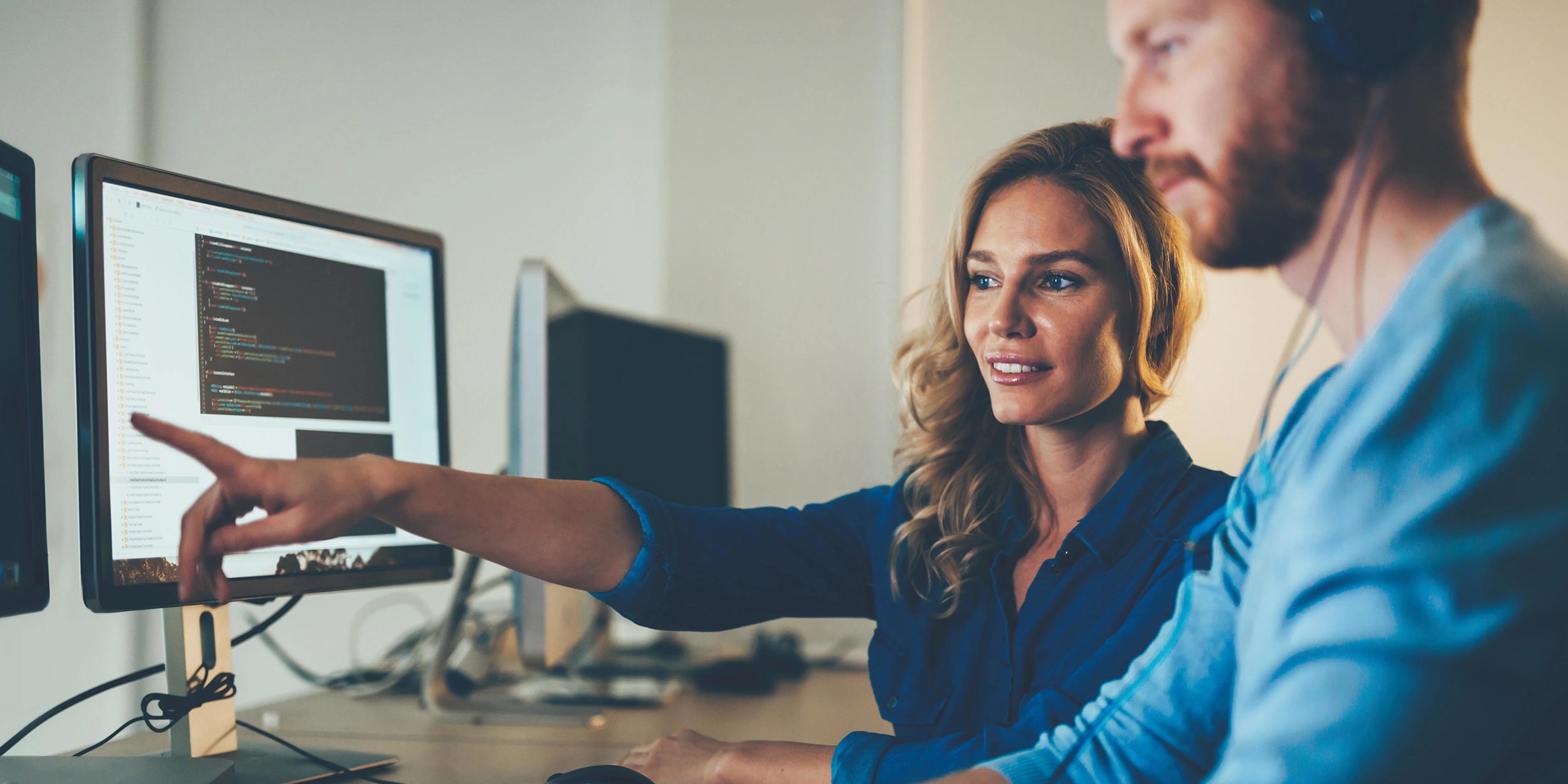 woman is pointing on computer