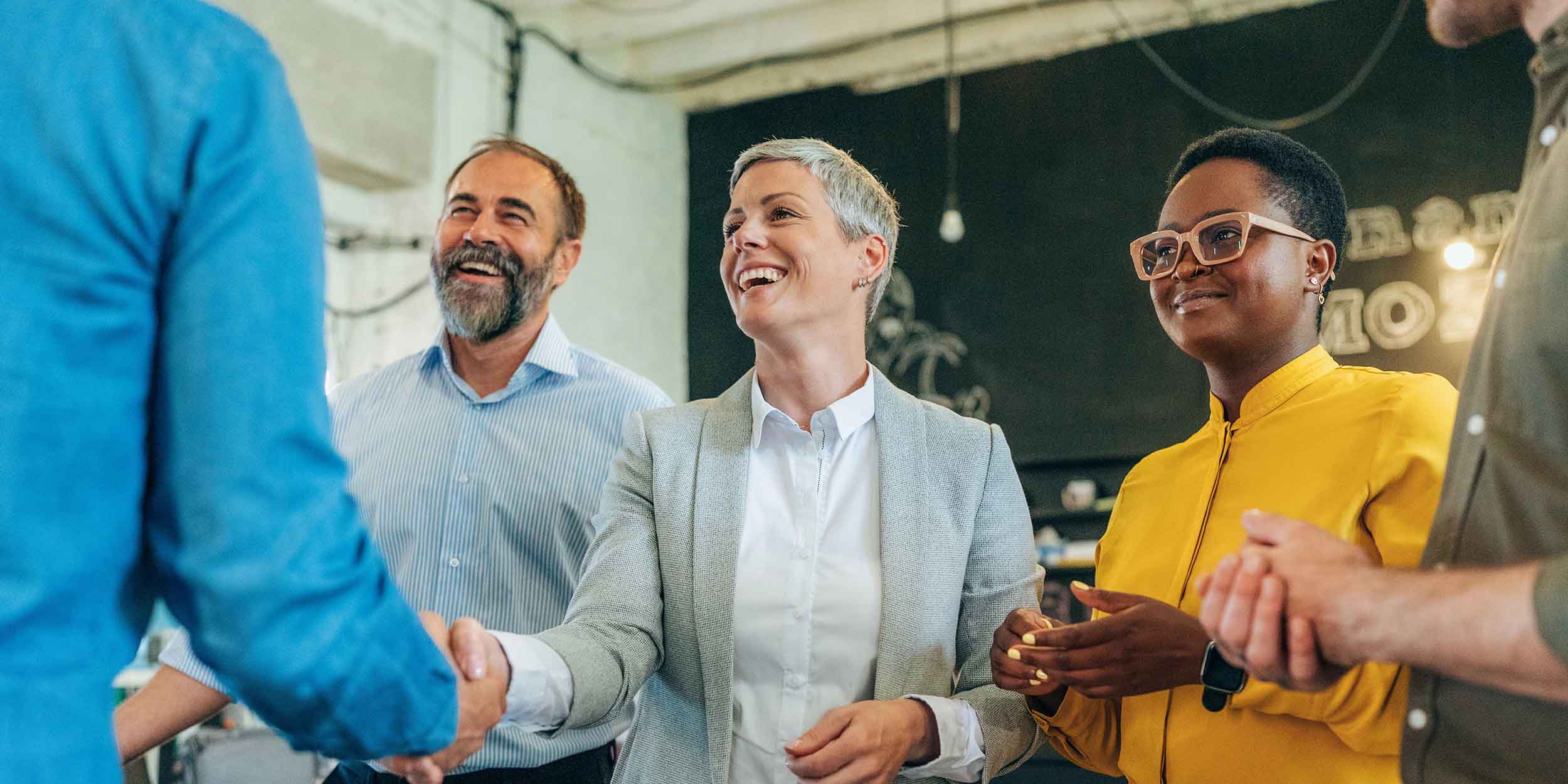 a group is welcoming a person