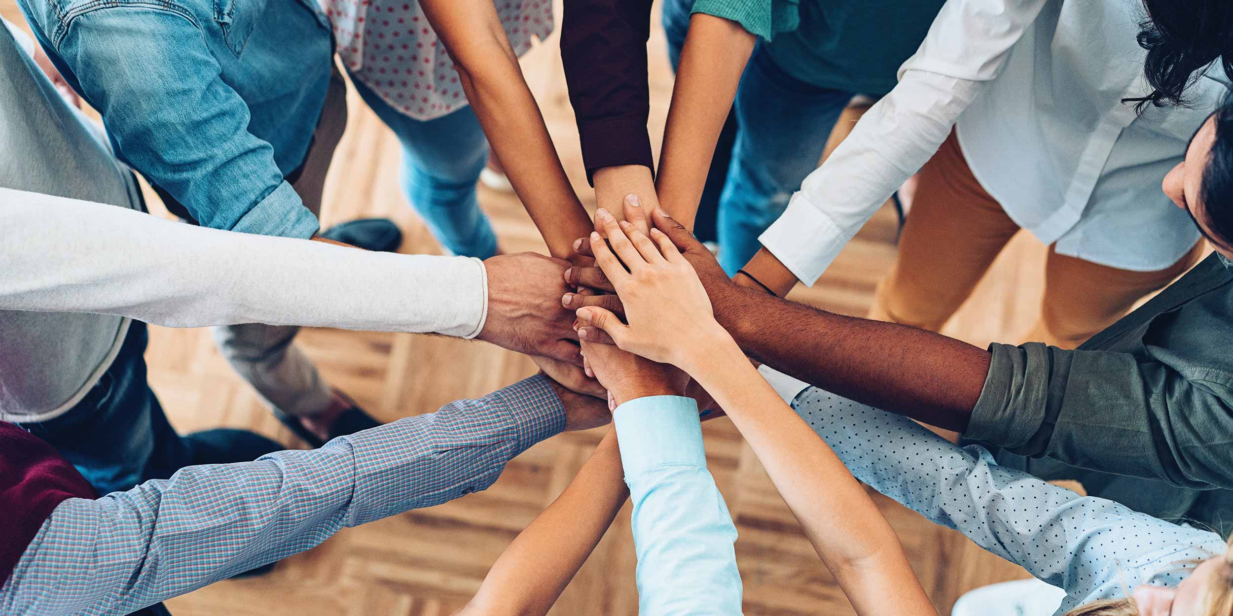 hands together in a huddle