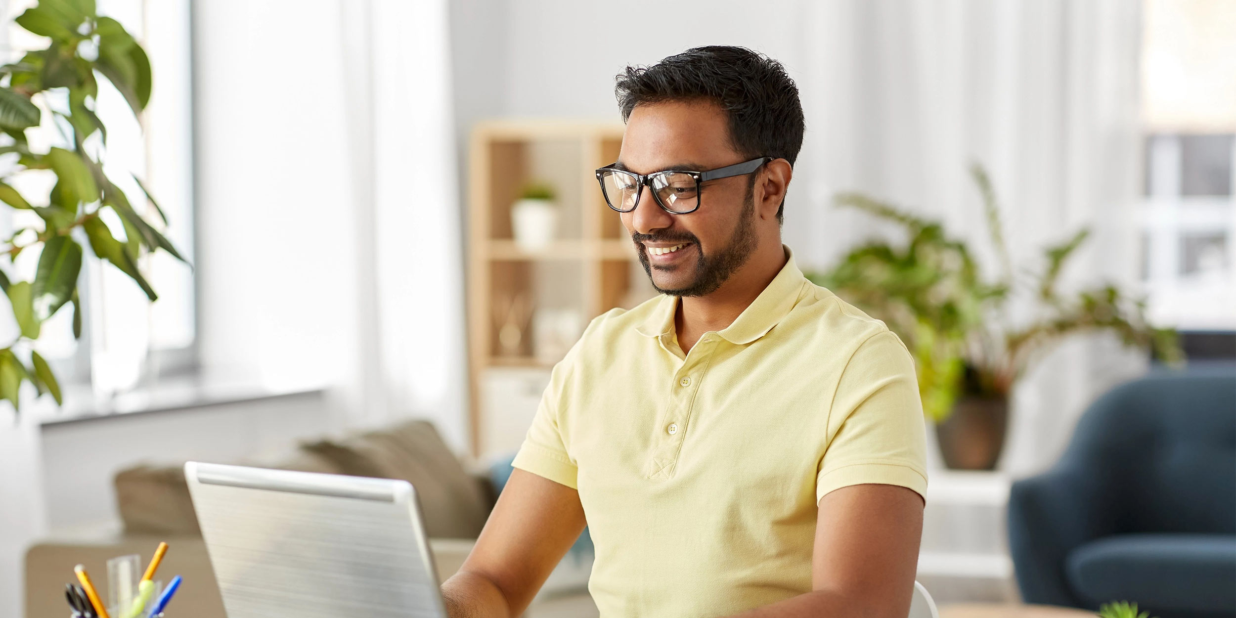 man tipping on laptop