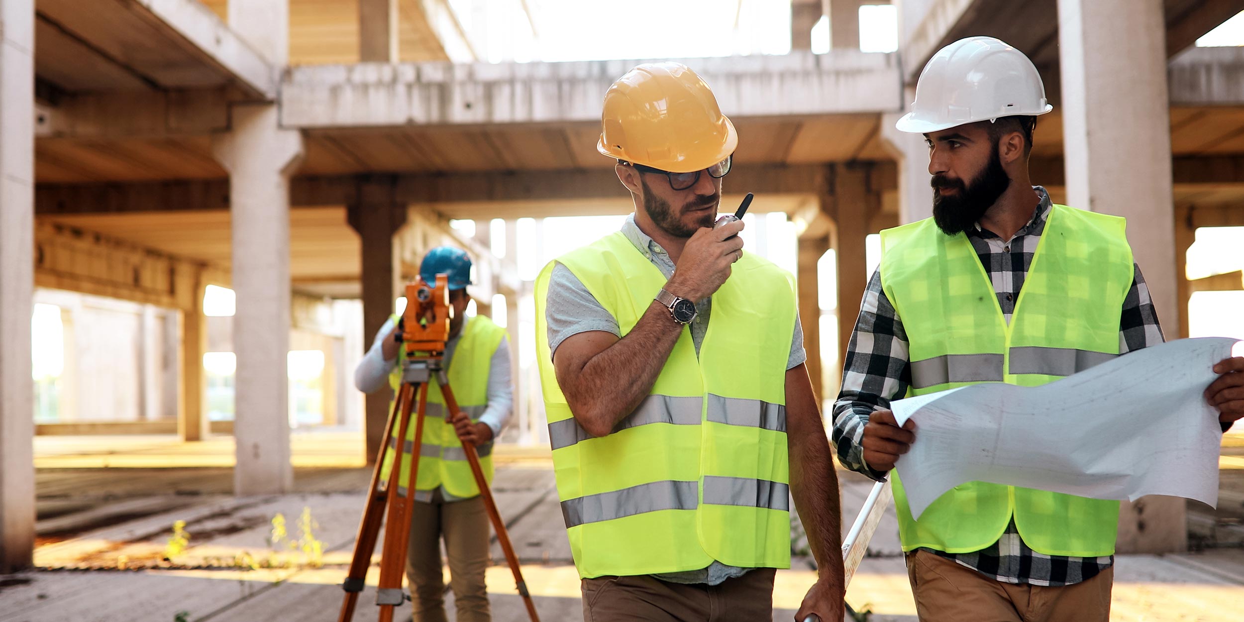 Architect consult engineer on construction site