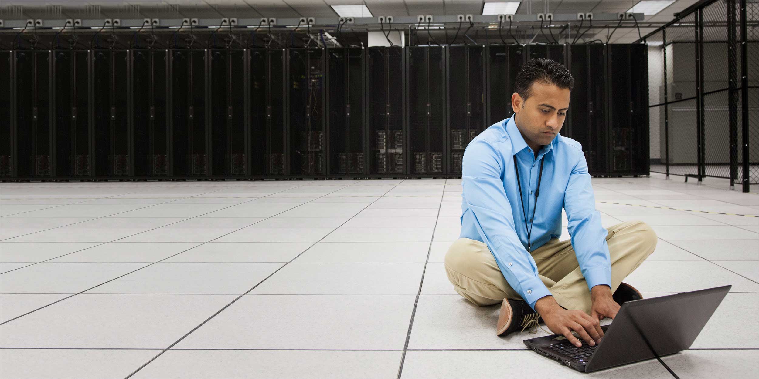 man sitting on the floor with laptop