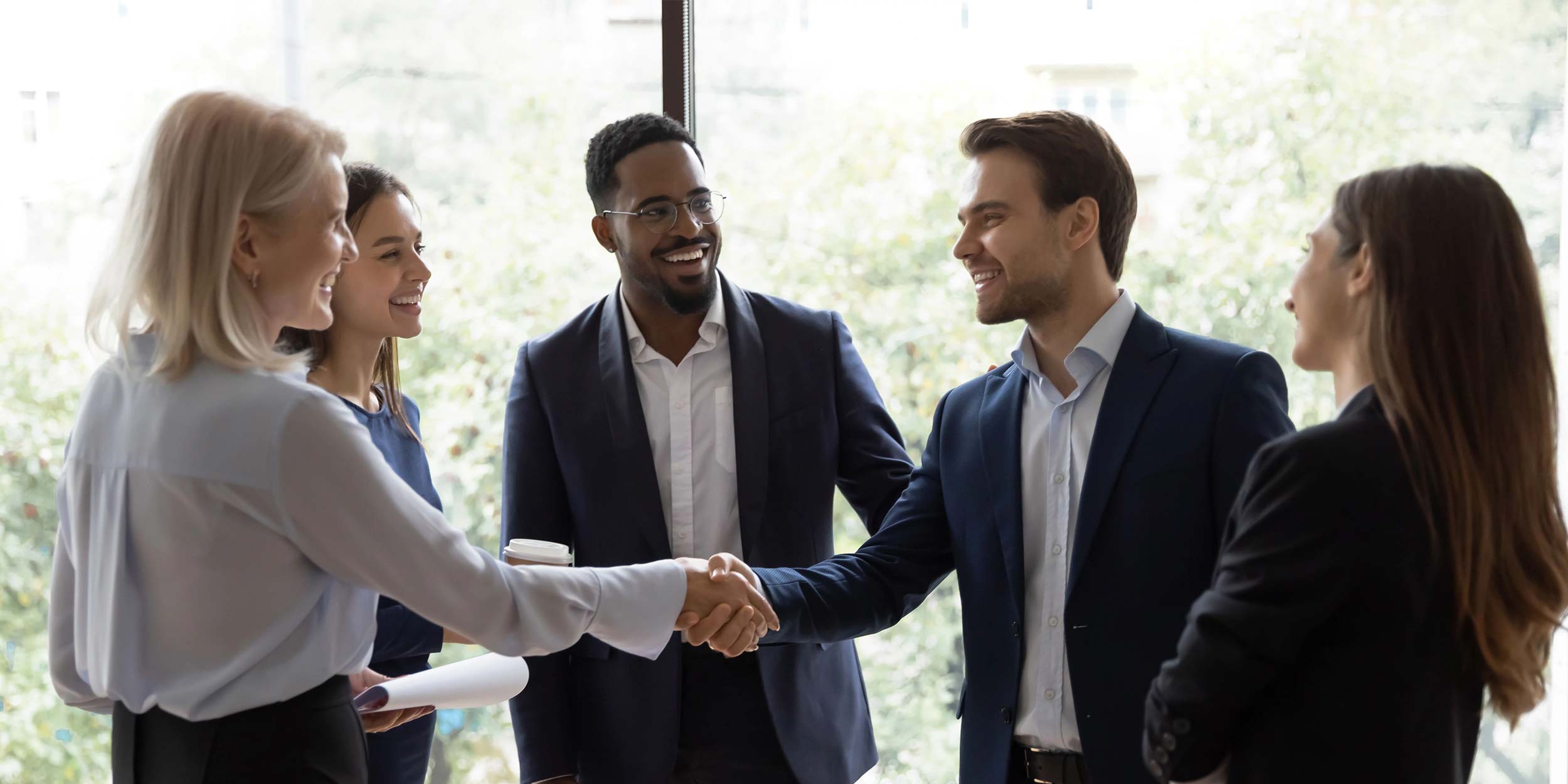 group of people are greeting each other