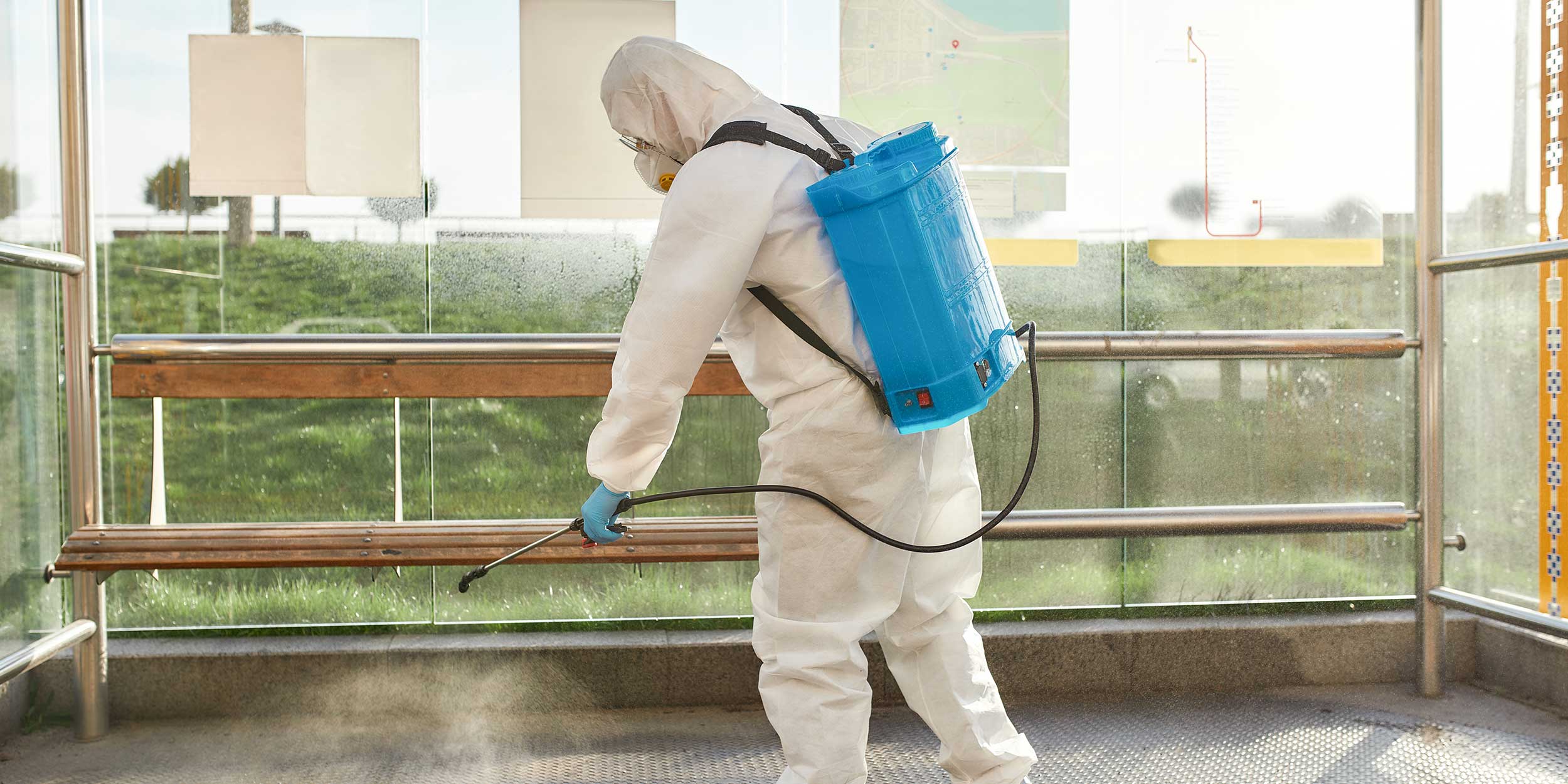 Man in protective suit and mask at work