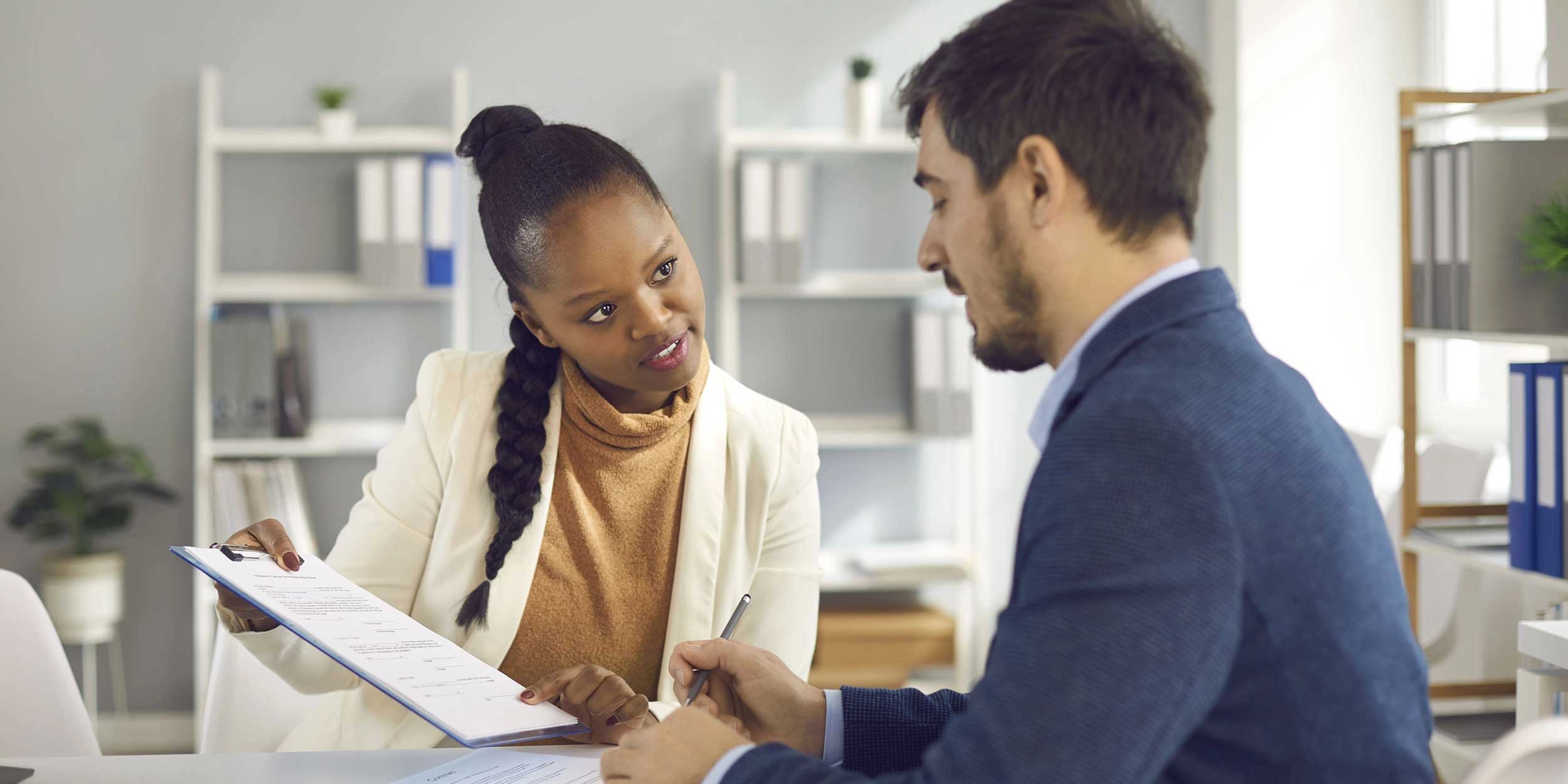 two colleagues discussing a paper