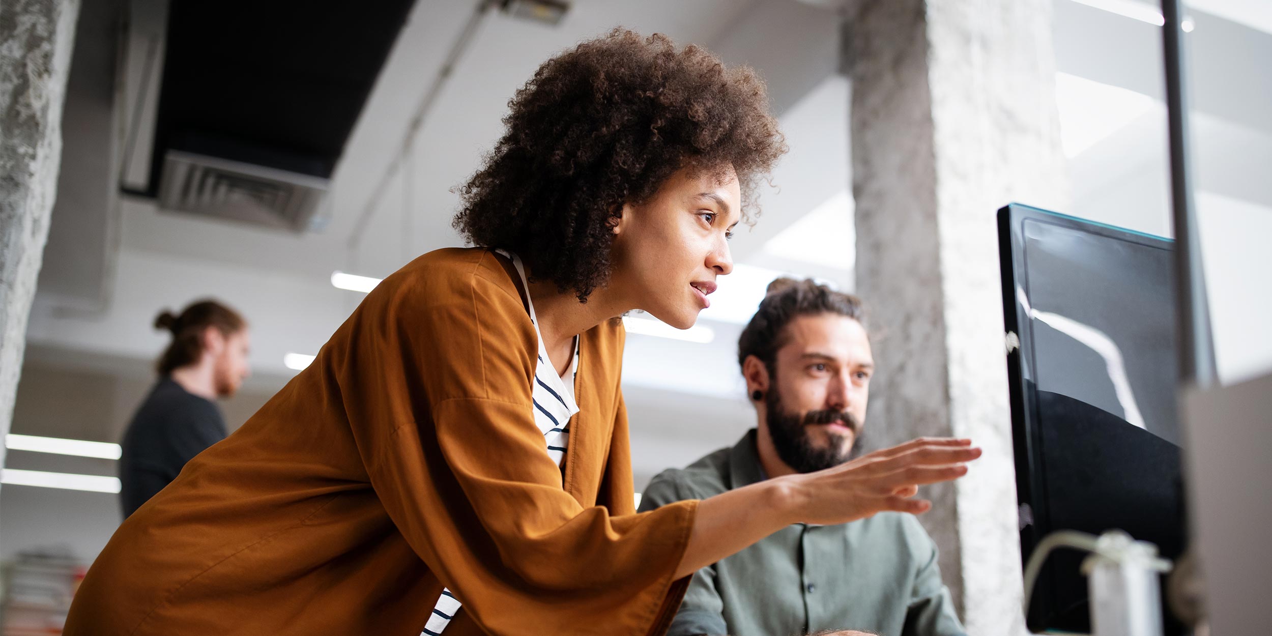 woman is showing something on computer